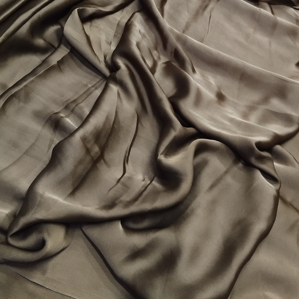 Dark taupe satin fabric with a soft sheen, smooth texture, and elegant flowing drape.