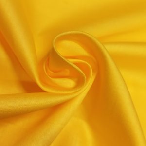Soft and smooth malai cotton fabric with a fine texture, suitable for dresses, kurtis, and ethnic wear.