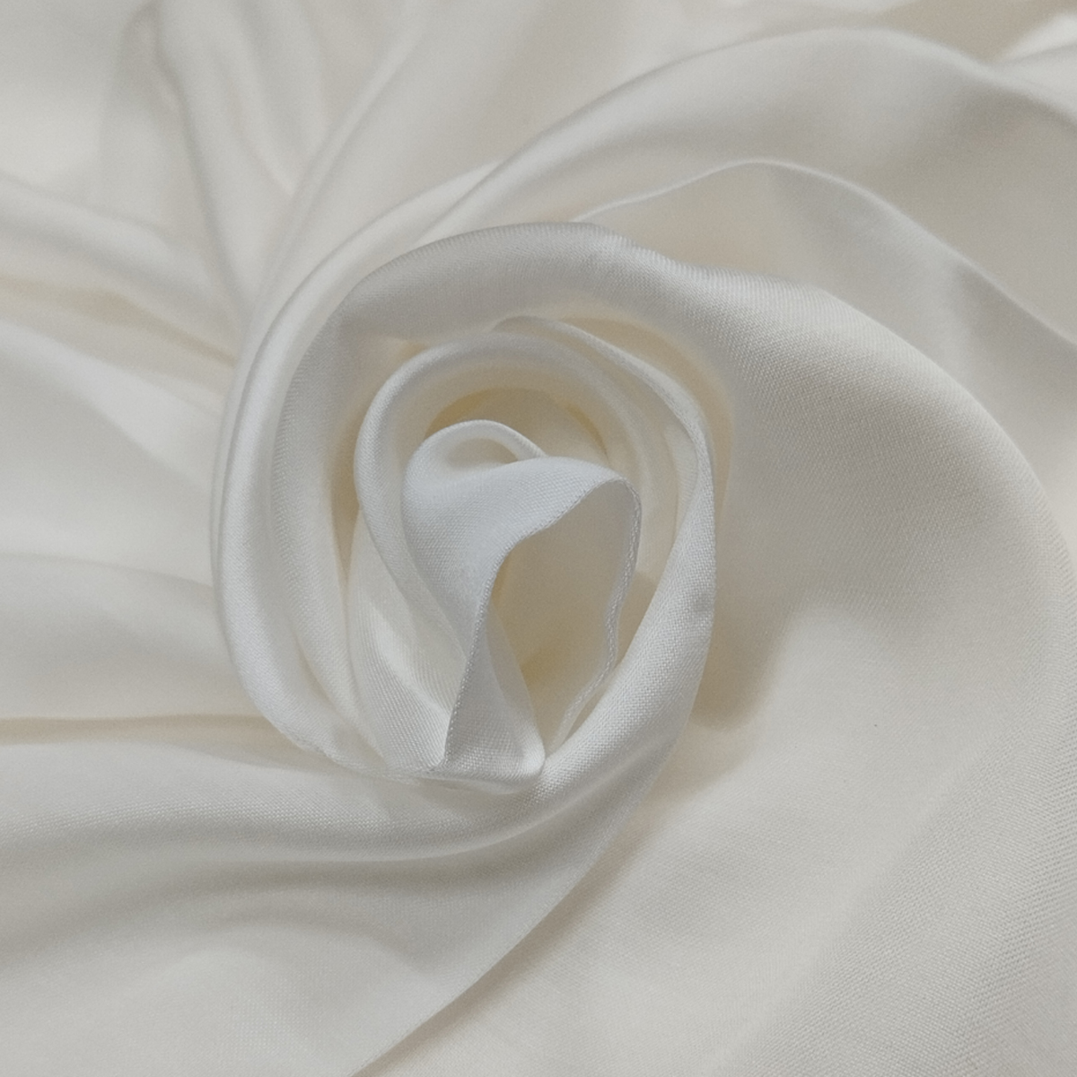 Premium modal satin fabric with silky smooth texture, glossy finish, and elegant flowing drape.