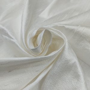 White 100 H Silk fabric with smooth glossy texture and elegant swirl drape pattern.