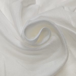 White Madras Silk fabric with soft sheen and elegant drape arranged in smooth folds.
