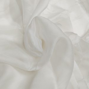 Soft white semi-sheer Mira Silk fabric with smooth texture and elegant drape