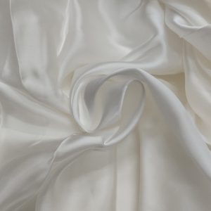 Dyeable Bemberg satin fabric with smooth glossy texture and luxurious soft folds.