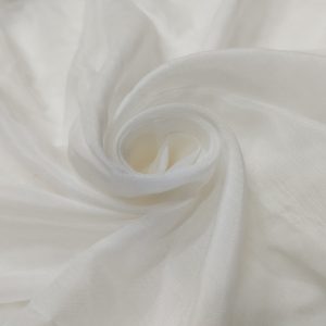 Premium heavy muslin fabric with soft matte texture and elegant flowing drape arranged in layered folds.