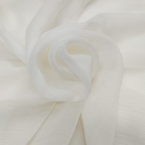 Premium white heavy chiffon fabric with soft semi-transparent texture and elegant flowing drape arranged in a swirl pattern.