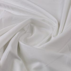 Soft malai cotton fabric with smooth flowing texture