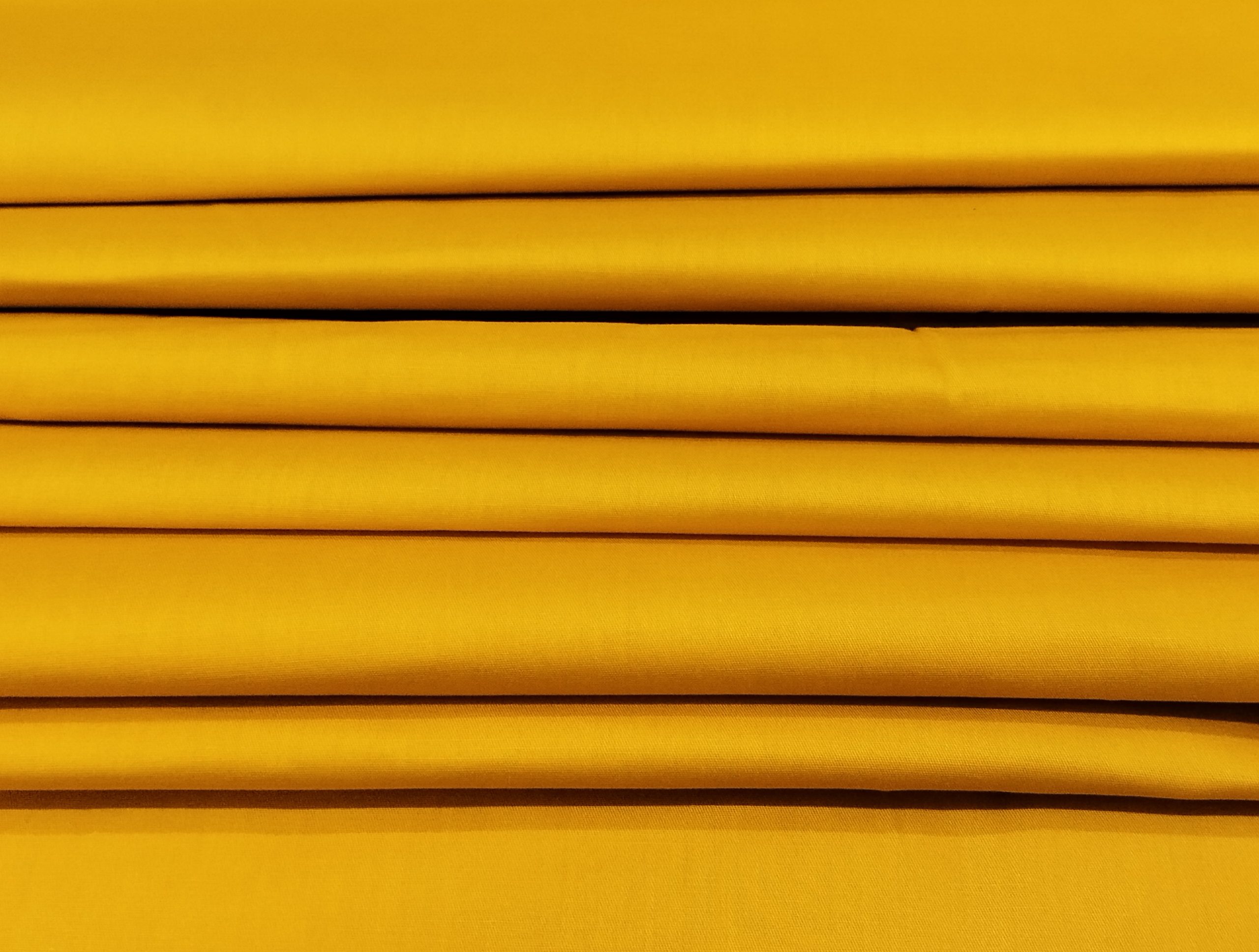 Breathable dyed Kiwi Cotton fabric with a lightweight feel and graceful natural fall