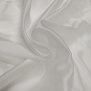 Elegant Satin Organza fabric with a glossy finish, sheer texture, and lightweight crisp drape for designer and festive wear.