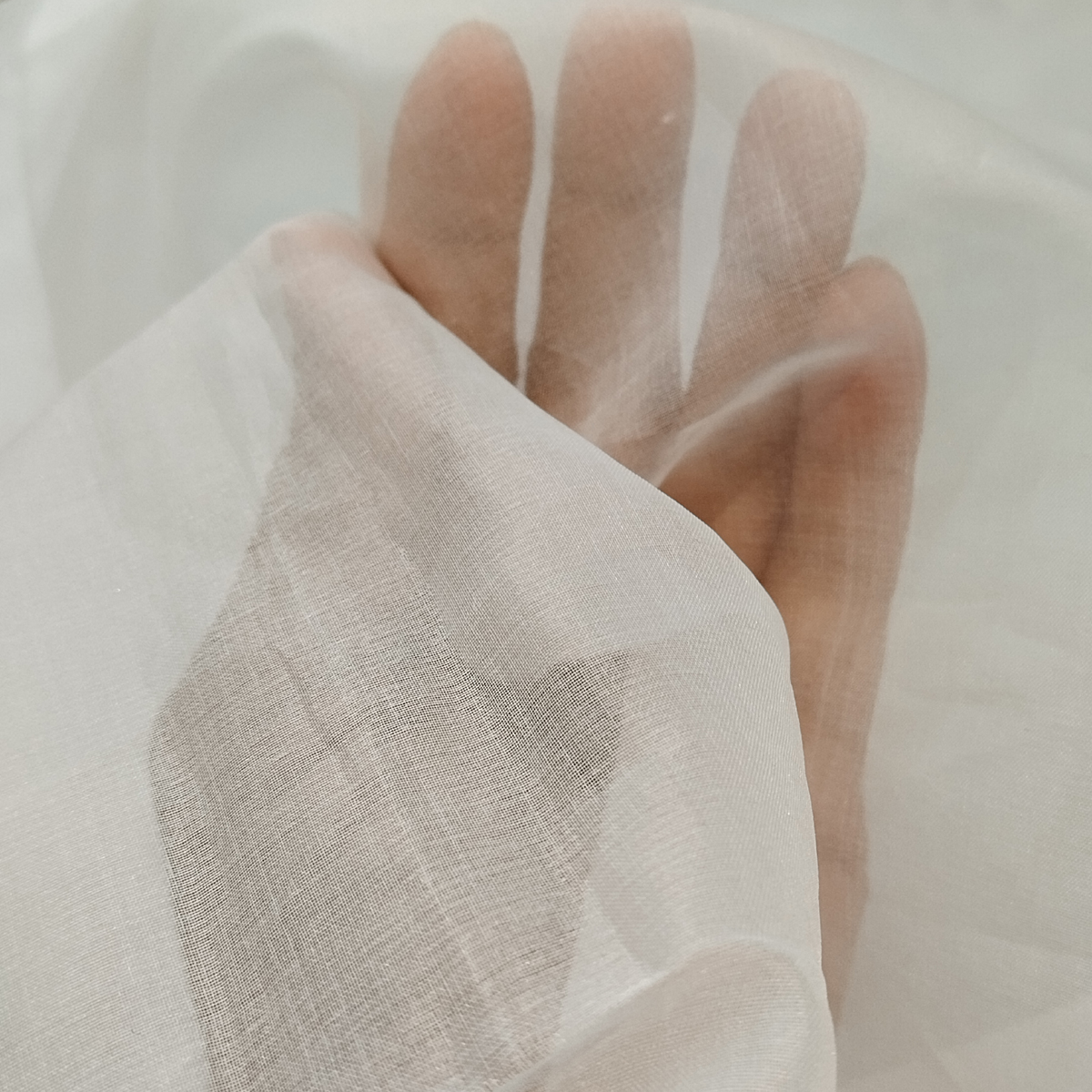 Pure Organza Fabric with a crisp texture, lightweight feel, and elegant sheer appearance.