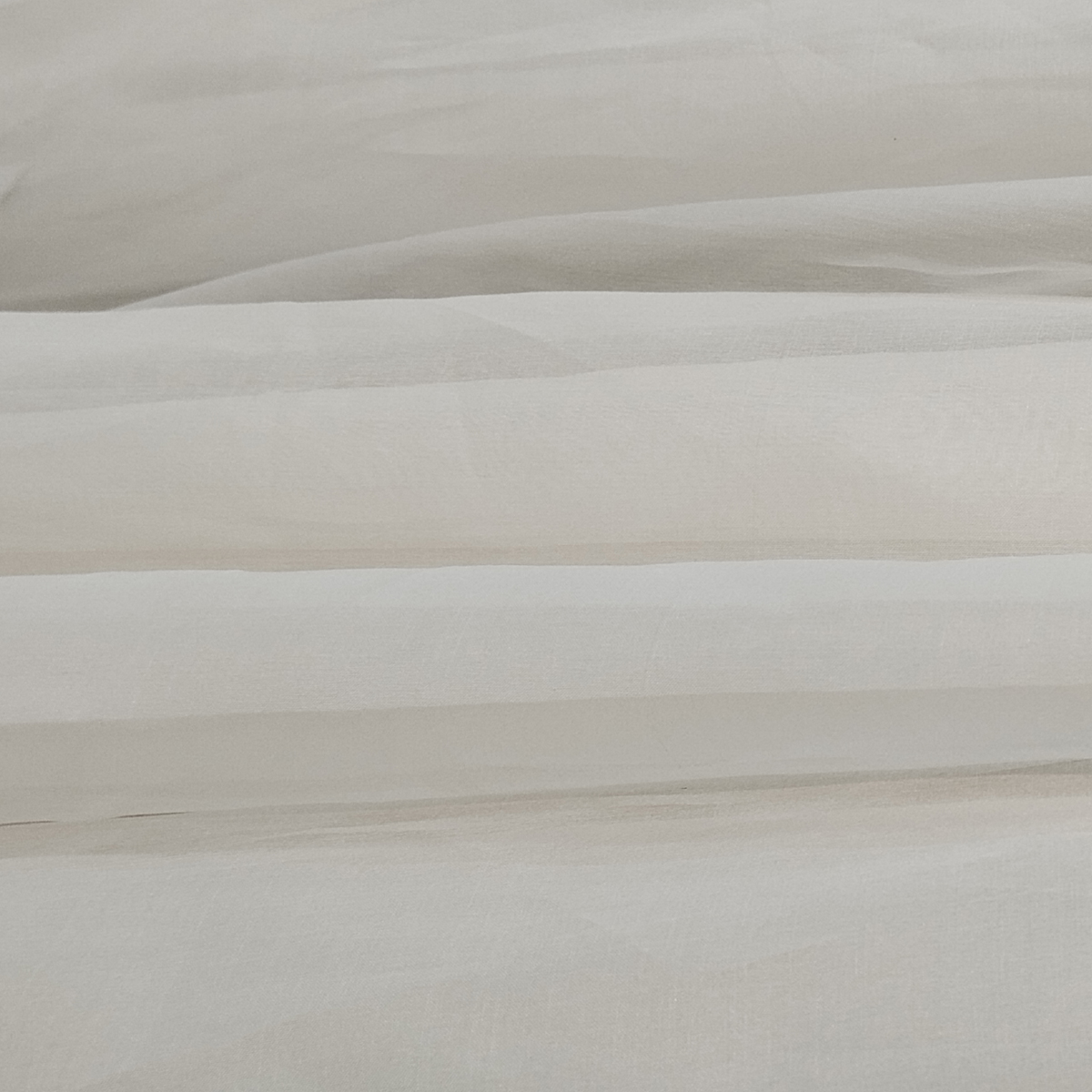 Pure Organza Fabric with a crisp texture, lightweight feel, and elegant sheer appearance.